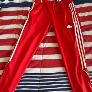 Red adidas striped pants